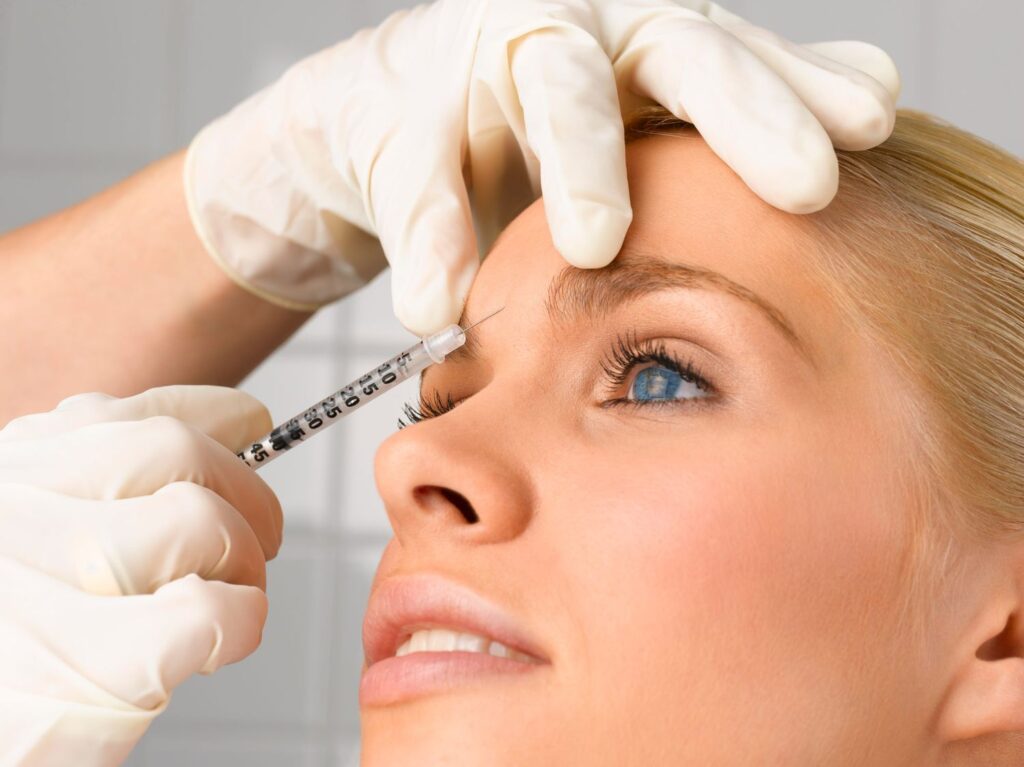A woman receives botox injections.